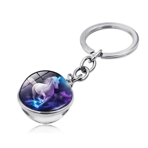 Close-up of magical unicorn illustration inside a double-sided glass dome keychain