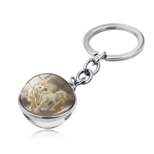 Detailed macro view of the silver unicorn glass ball keychain with an alloy base