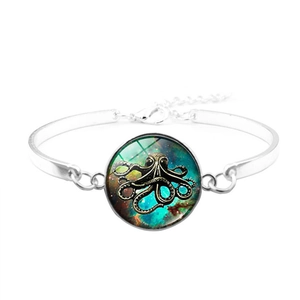 Silver bracelet with a vintage octopus glass cabochon featuring a galaxy nebula theme