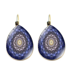 Detailed view of teardrop earrings with purple mandala pattern and gold metal hooks