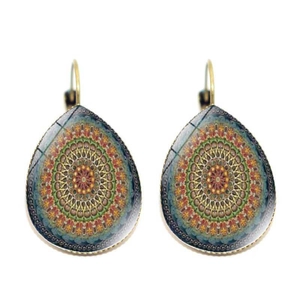 Detailed view of teardrop earrings with colorful mandala patterns and golden leverback hooks