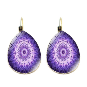 Detail of vintage teardrop earrings featuring purple mandala pattern and gold hooks