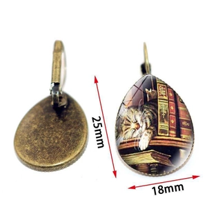 Vintage bronze teardrop earrings with sleeping cat on bookshelf glass cabochon art