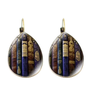 Detailed view of bronze teardrop earrings featuring vintage classic book spine motifs