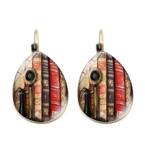 Detail of teardrop glass earrings with vintage library and book art in bronze finish