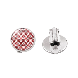 Detail of red and white heart checkerboard clip-on earrings with silver metal backing