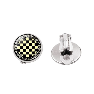Detail view of silver clip-on earrings with black and white checkerboard and vintage pattern