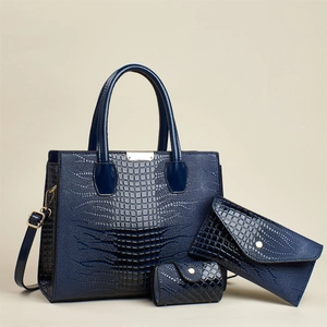 Deep blue three-piece set with crocodile pattern tote bag, clutch, and coin purse
