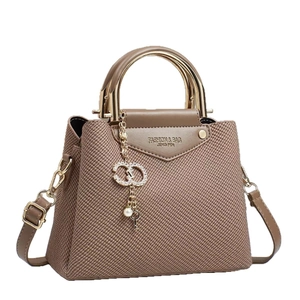Brown woven canvas handbag with gold metal handle and luxury rhinestone pearl pendant
