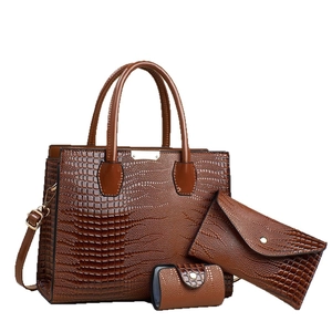 Three-piece brown lizard texture tote bag set with envelope clutch and mini coin purse