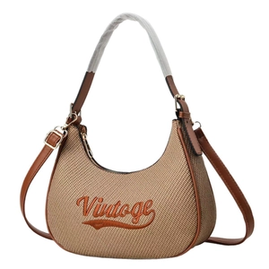 Vintage canvas hobo bag with embroidery and adjustable leather shoulder strap in tan