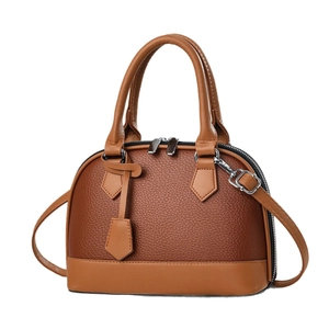 Classic brown two-tone shell handbag in pebble leather with adjustable shoulder strap