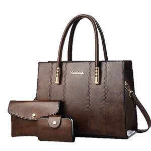 Three-piece dark brown faux leather handbag set with contrast stitching and gold hardware