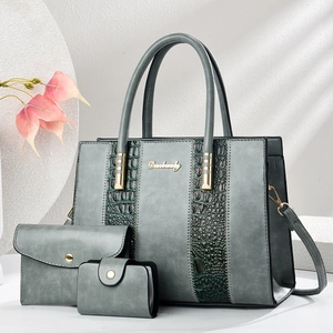 Three-piece grey handbag set featuring stylish crocodile pattern patchwork and metal handles