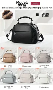 Detail view of multi-compartment leather handbag in various colors with pebbled texture