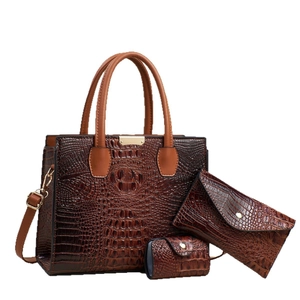 Three-piece women's tote set in dark brown crocodile texture with matching wallet and pouch