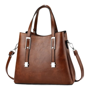 Elegant brown faux leather tote handbag with lychee texture and adjustable shoulder strap