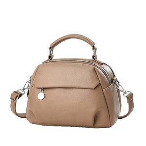 Minimalist beige macaron handbag with top handle and adjustable shoulder strap