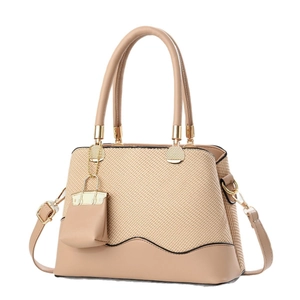 Chic beige woven texture tote bag with leather trim and matching mini pouch pendant