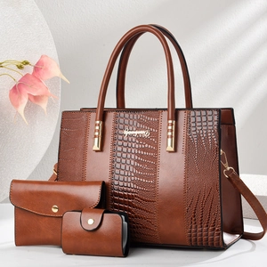 Three-piece brown faux crocodile leather tote bag set with matching wallet and card holder