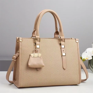Beige woven texture handbag with leather handles and crossbody strap for women