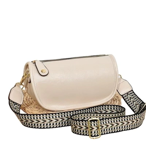Chic beige half-moon shoulder bag with retro woven strap on minimalist white background