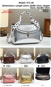 Detail view of crocodile pattern saddle bags in six colors with interior layers and dimensions