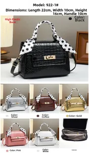 Detail view of stylish stone pattern handbag with scarf handle and secure gold twist lock
