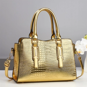 Golden crocodile embossed large shoulder bag with sturdy handles and metallic finish