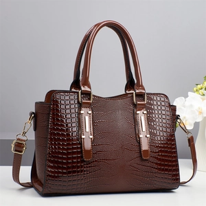 Chic dark brown crocodile embossed leather tote bag with gold hardware and shoulder strap