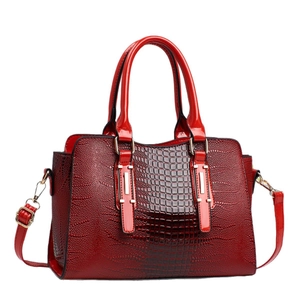 Deep red crocodile embossed tote bag with glossy finish and detachable shoulder strap