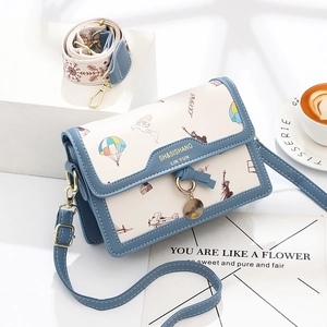 Fashionable travel-themed crossbody bag with blue contrast trim and artistic map prints