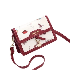 Retro travel themed crossbody bag with colorful graffiti prints and wine red leather trim