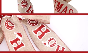 Detail of faux linen Christmas ribbon featuring red glitter HO HO HO print and wired edges