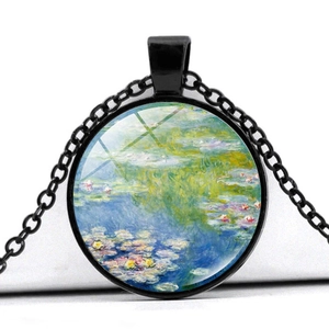 Close-up of glass dome pendant with Monet Water Lilies art in black frame
