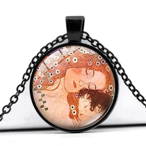 Detail of round Van Gogh style glass pendant on a black metal link chain necklace