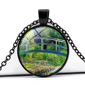 Detail of artistic round pendant showing a colorful Monet Japanese Bridge glass dome