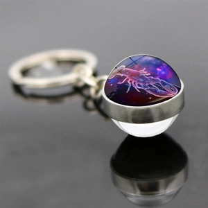 Double-sided glass ball zodiac keychain with a pink lobster design and starry sky pattern