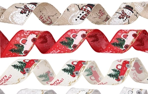 Close-up of Christmas ribbons with snowmen and vintage trucks with gold glitter edges