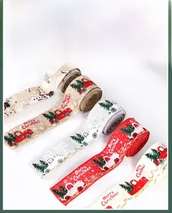Close-up of assorted Christmas ribbons with red trucks, snowmen, and gold glitter edges