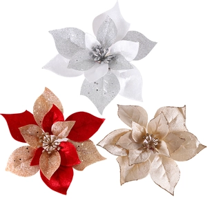 Three glittery artificial Christmas poinsettia flowers in red, silver and champagne gold