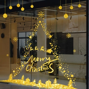 Stickers de Noël dorés scintillants pour vitrines avec lettrage et silhouettes de rennes