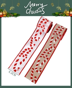 Detail view of 6.3cm Christmas ribbons with candy cane prints and red stitched edges