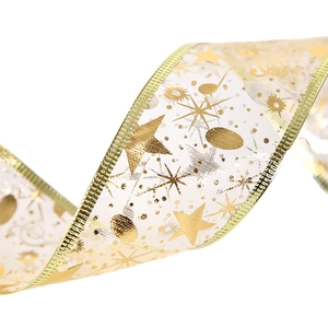 White semi-transparent Christmas ribbon with gold foil stars and music notes patterns