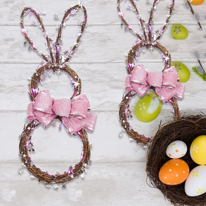 Easter bunny wreath made of natural rattan with pink glitter bow and LED star lights