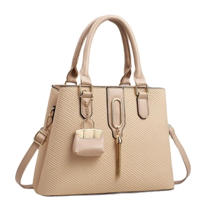 Chic macaron apricot woven handbag with dual handles and crossbody strap for women