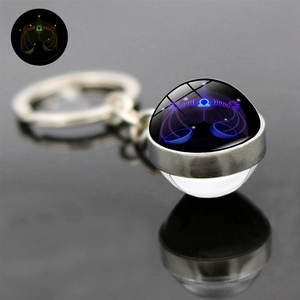 Detail of Libra zodiac keychain with luminous double-sided glass ball and metal ring