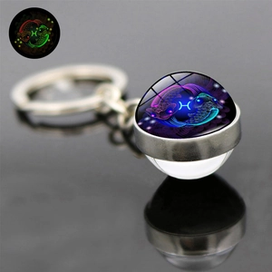 Luminous Pisces zodiac glass ball keychain with double-sided glowing effect on silver ring