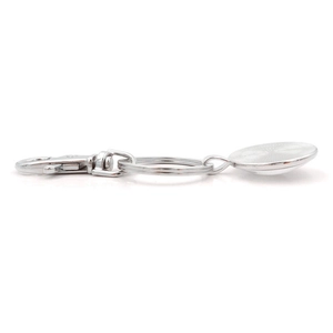 Detail view of silver metal keychain with lobster clasp and round pendant tray