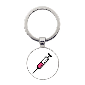 Detailed macro view of nurse medical syringe pendant with silver metal keychain ring